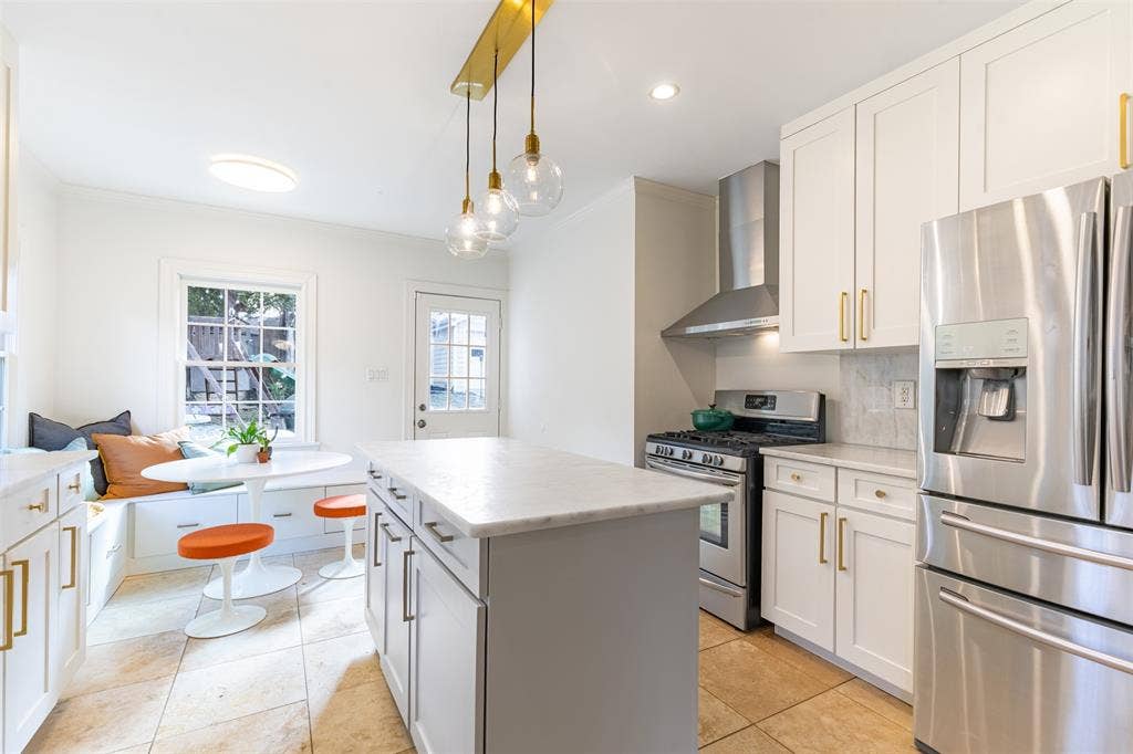 Take a closer look at the built-in seating area. Beneath the bench you'll find lots of storage in the pull-out drawers. You're welcome!