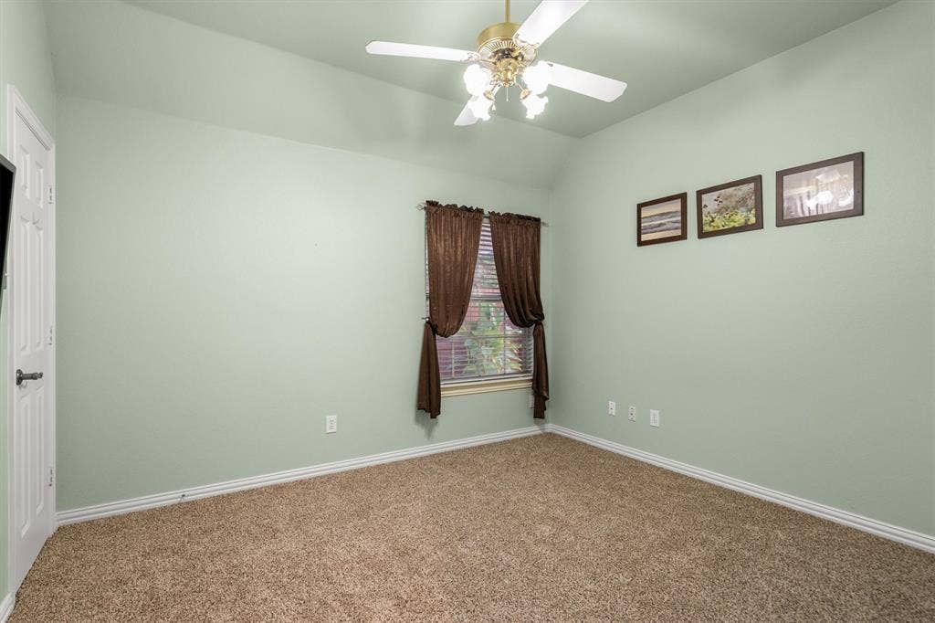 Bedroom with walk in closet and new carpet