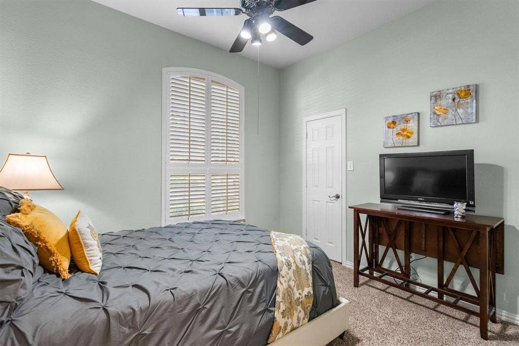 Bedroom with walk in closet and new carpet