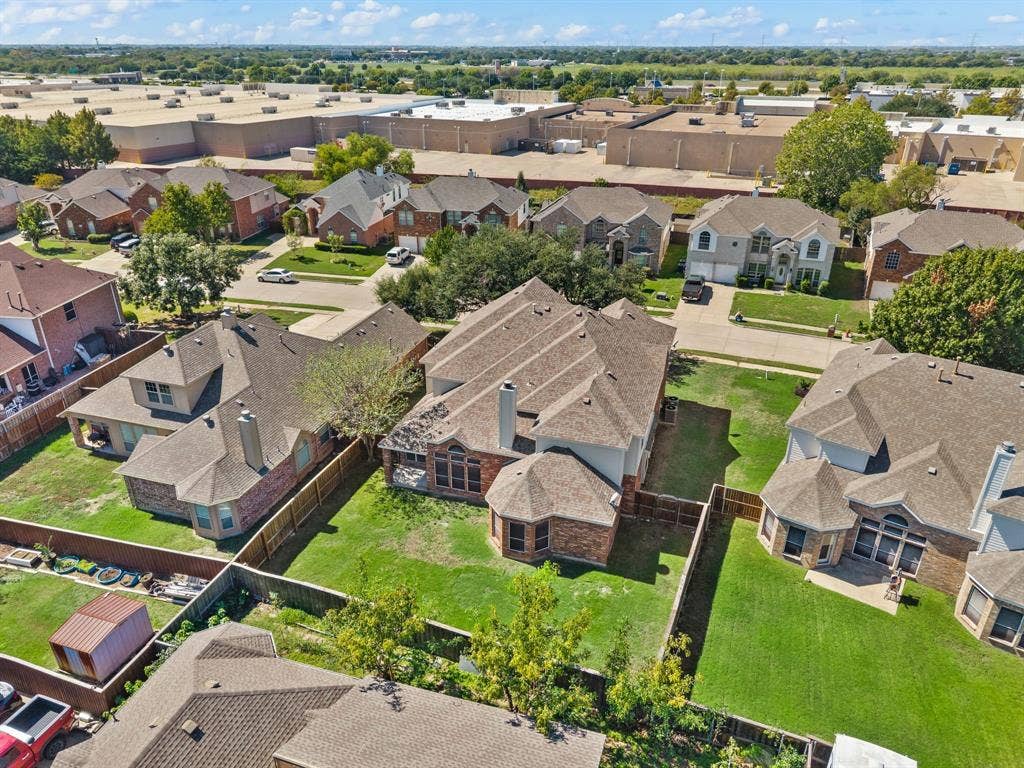 Get a bird’s-eye view of the home’s setting, with a generous backyard & surrounding neighborhood streets.