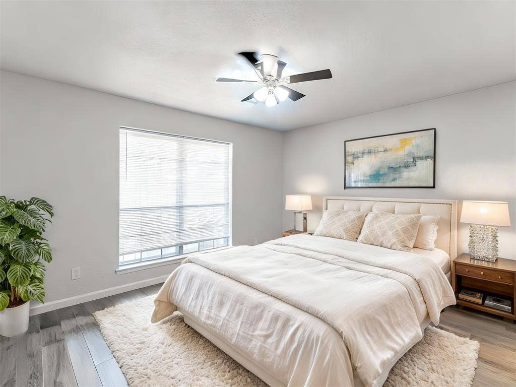 9326 Emberglow Lane, Dallas, TX 75243 Bedroom 1 featuring light wood-style floors and a ceiling fan