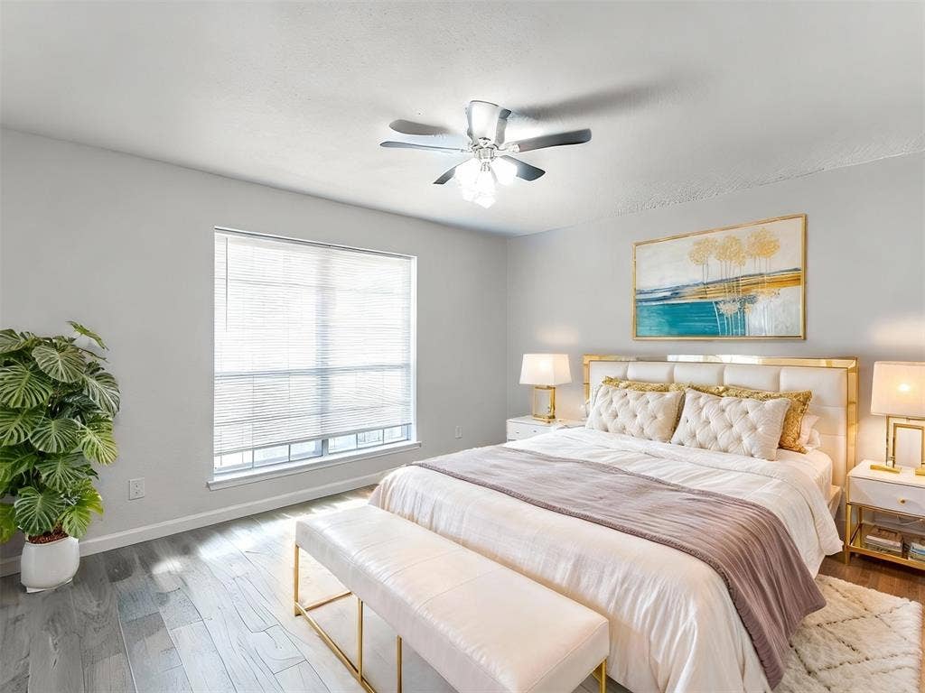 9326 Emberglow Lane, Dallas, TX 75243 Bedroom 2 featuring wood finished floors and a ceiling fan