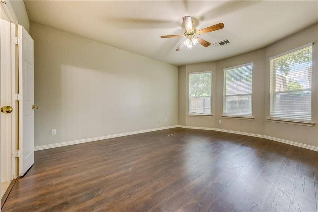 2300 Reston Drive, McKinney, TX 75072 Spare room with ceiling fan and dark wood-type flooring