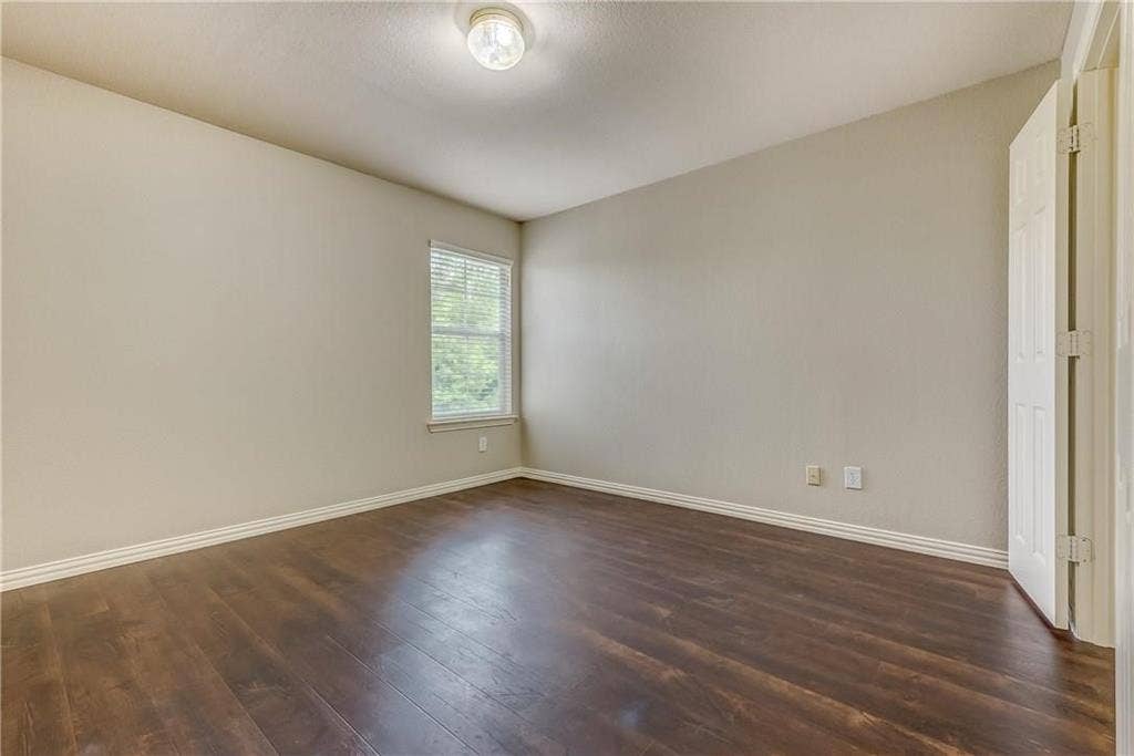 2300 Reston Drive, McKinney, TX 75072 Unfurnished room featuring dark hardwood / wood-style flooring
