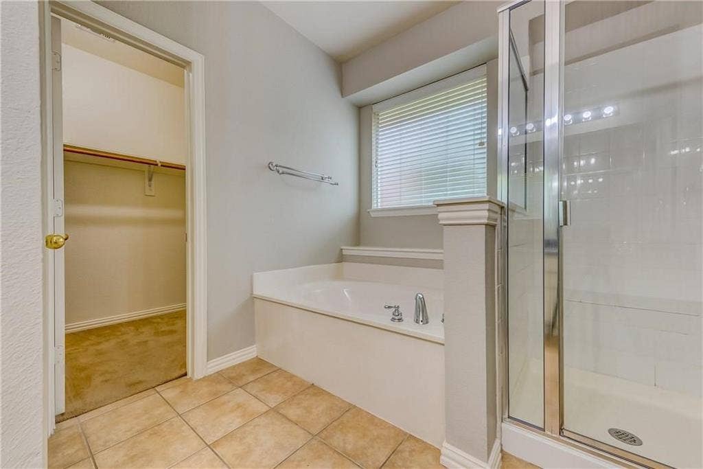 2300 Reston Drive, McKinney, TX 75072 Bathroom with tile floors and separate shower and tub