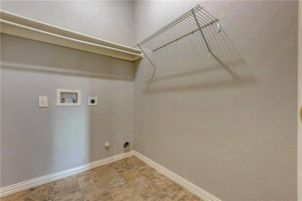 2300 Reston Drive, McKinney, TX 75072 Laundry area with gas dryer hookup, washer hookup, light tile floors, and electric dryer hookup