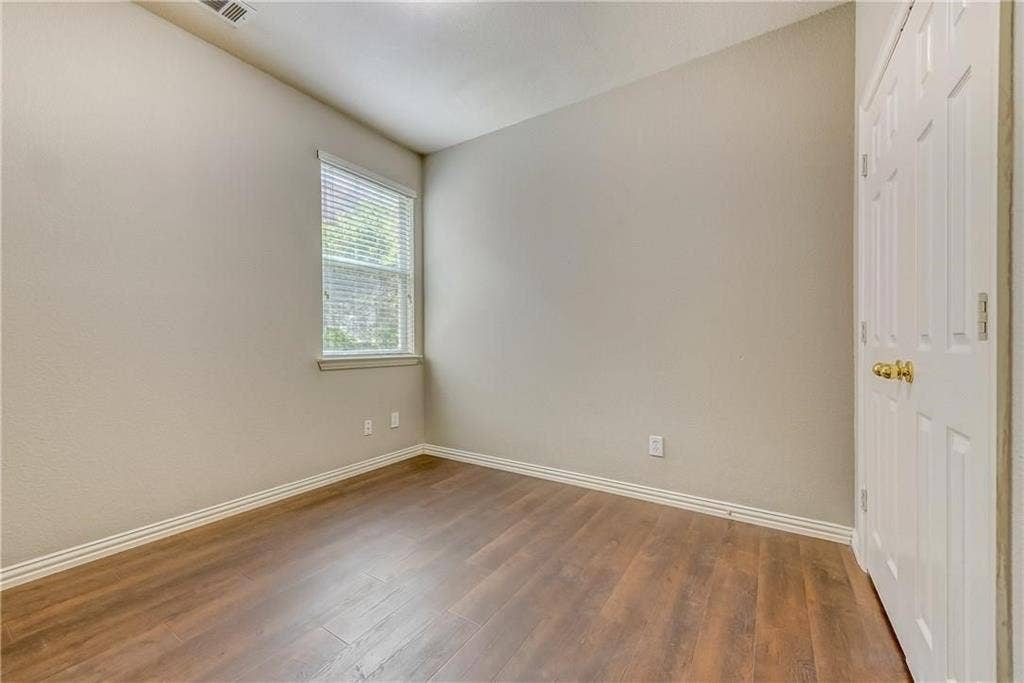 2300 Reston Drive, McKinney, TX 75072 Spare room featuring wood-type flooring