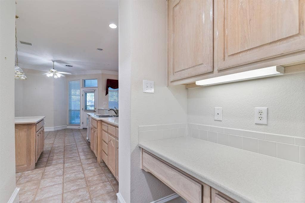 6216 Wolf Ridge Drive, Plano, TX 75024 Built in desk area could be renovated into a butlers pantry
