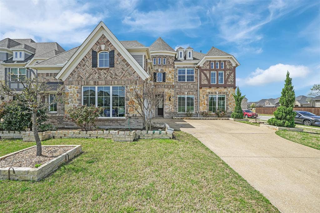302 Torch Lily Lane, Wylie, TX 75098 Brick and stone exterior with gabled roof lines