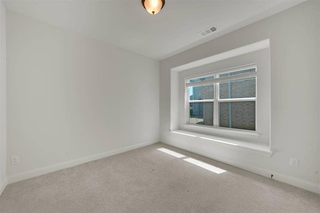 302 Torch Lily Lane, Wylie, TX 75098 Neutral paint palette with light gray carpeting, recessed window featuring a broad sill, and a flush-mount ceiling light