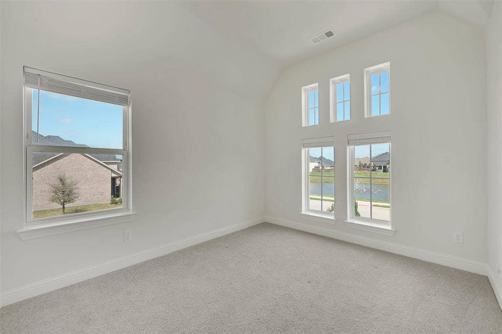 302 Torch Lily Lane, Wylie, TX 75098 High ceilings with multiple windows, providing abundant natural light