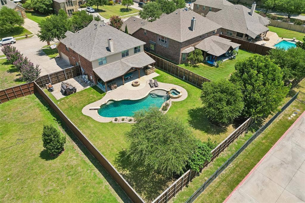 5732 Chateau Drive, Sachse, TX 75048 Ample yard space and additional parking behind double gate!