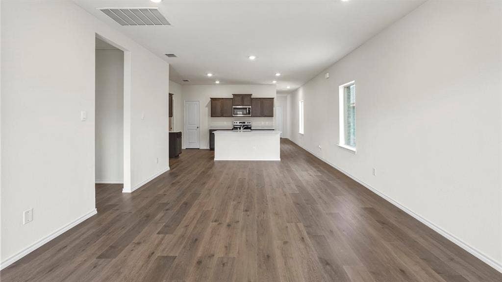 1671 Blaire Drive, Tyler, TX 75702 Spacious open concept room featuring wood-finish flooring, recessed lighting, and white painted walls