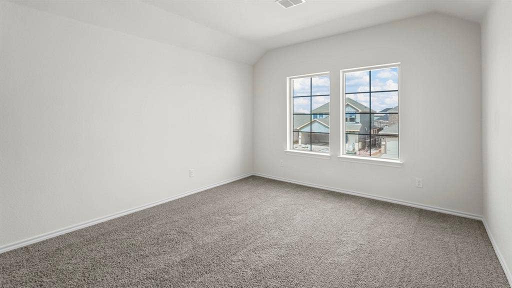 1671 Blaire Drive, Tyler, TX 75702 Vaulted ceiling, two pane windows, dark grid windowpanes, light wall paint, gray carpet