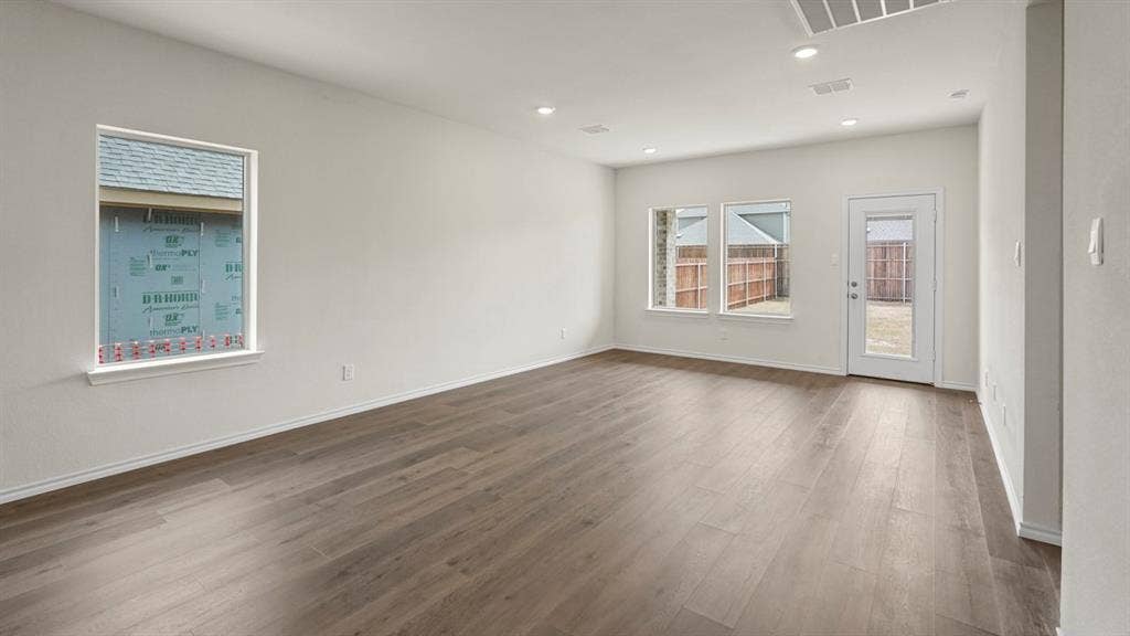 1671 Blaire Drive, Tyler, TX 75702 Wood-finish flooring, recessed lighting, and multiple windows