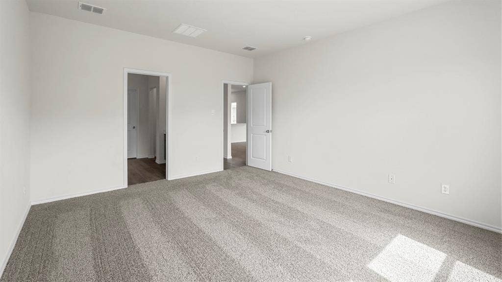1671 Blaire Drive, Tyler, TX 75702 Spacious room featuring gray carpeting and white walls