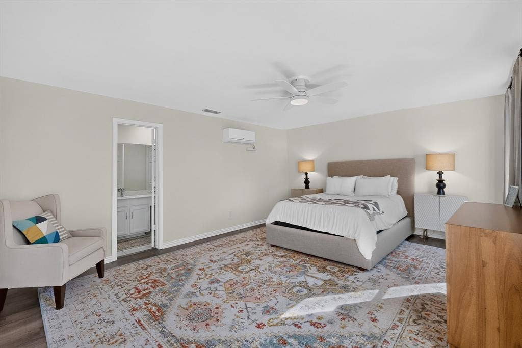 17335 Remington Park Place, Dallas, TX 75252 Neutral wall tones with dark wood-finish flooring