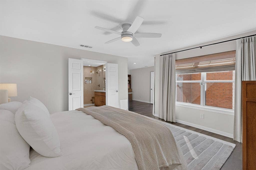 17335 Remington Park Place, Dallas, TX 75252 White ceiling fan, wood-finish flooring, and white window frames