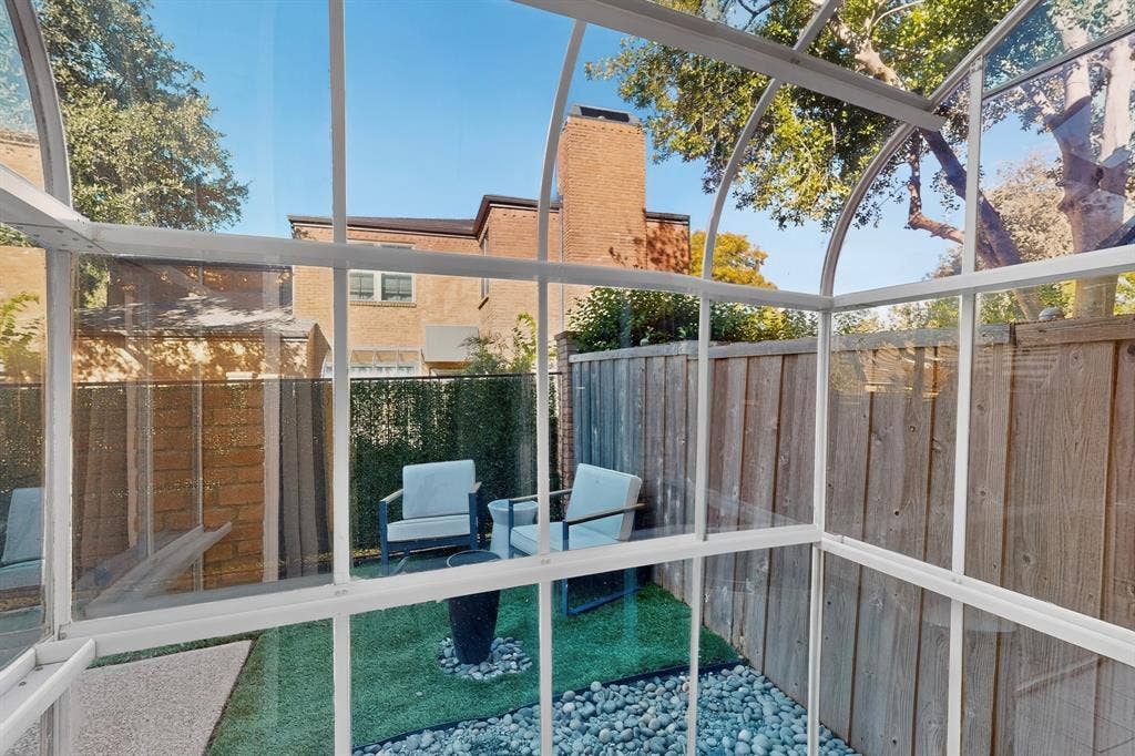 17335 Remington Park Place, Dallas, TX 75252 Enclosed outdoor structure with a glass roof and wall panels, offering a private setting