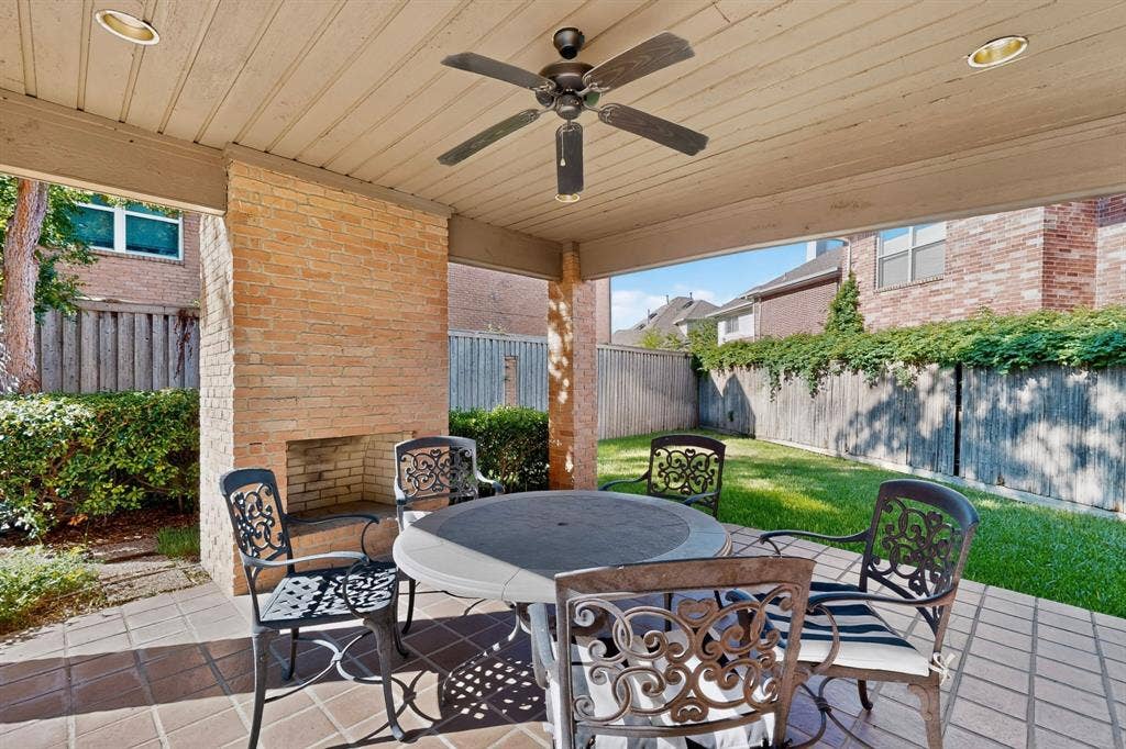 17335 Remington Park Place, Dallas, TX 75252 Community covered outdoor patio featuring brick flooring, recessed lighting, and an outdoor ceiling fan