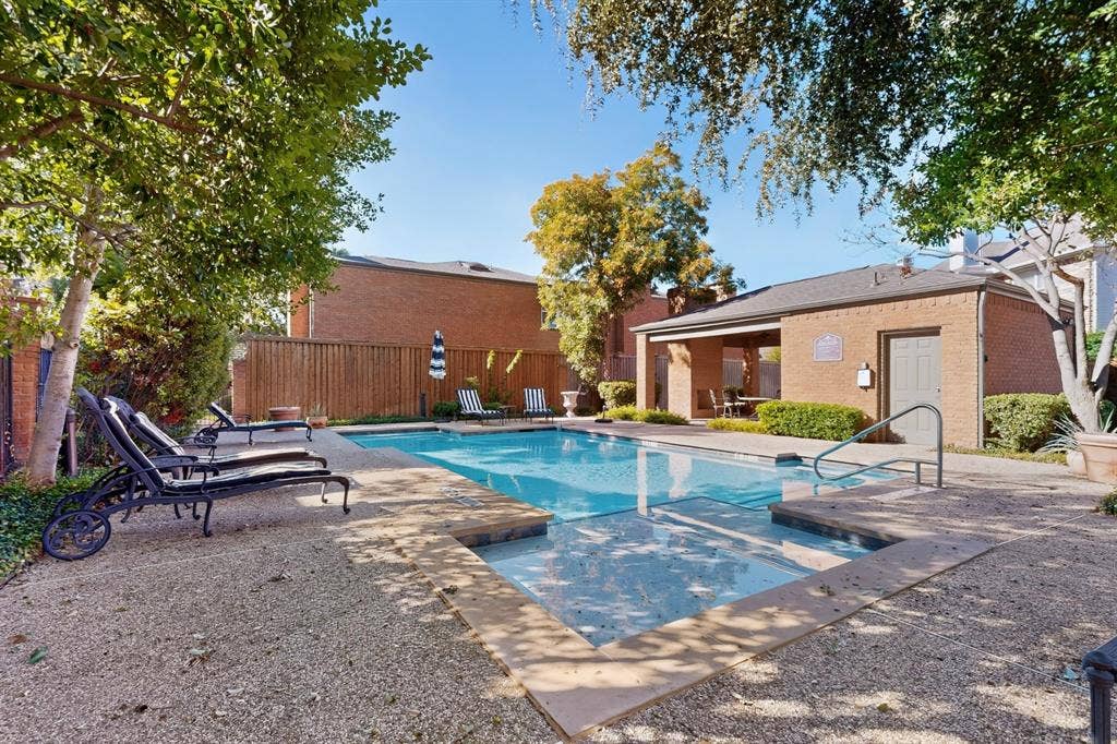 17335 Remington Park Place, Dallas, TX 75252 Community Swimming pool with concrete decking, surrounding gravel, and mature landscaping