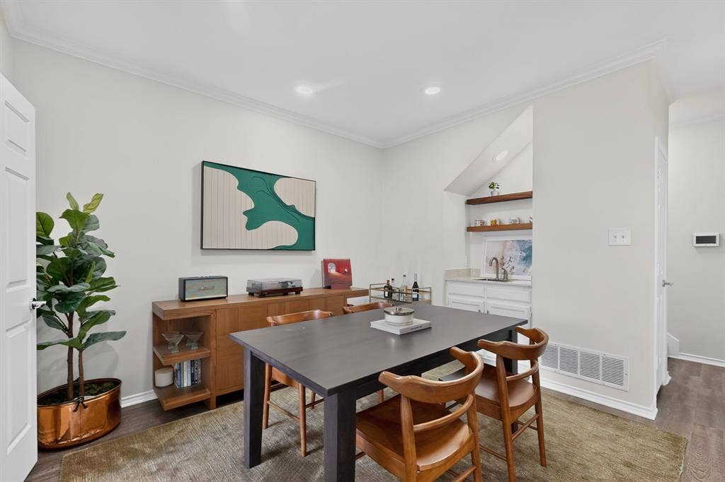 17335 Remington Park Place, Dallas, TX 75252 Recessed lighting, crown molding, wood-finish flooring, built-in wet bar with shelving, white cabinetry