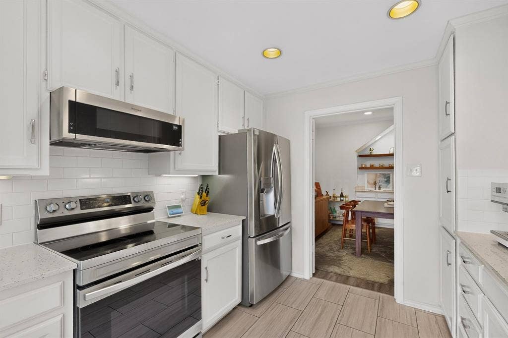 17335 Remington Park Place, Dallas, TX 75252 White cabinetry with brushed nickel hardware