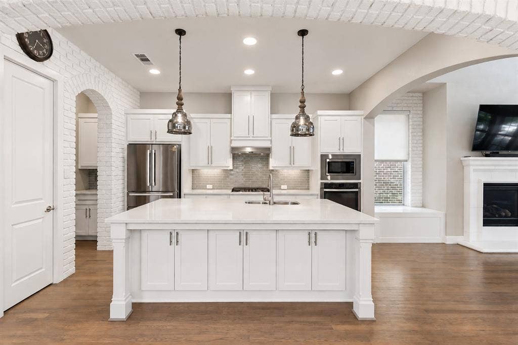 6920 Royal View Drive, McKinney, TX 75070 Virtually Whitened Brick and Kitchen Island Legs
