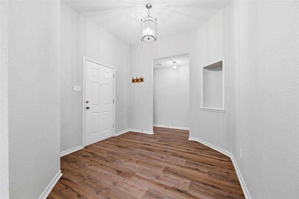 Bright and spacious entry foyer welcomes  guests into this beautifully updated home.