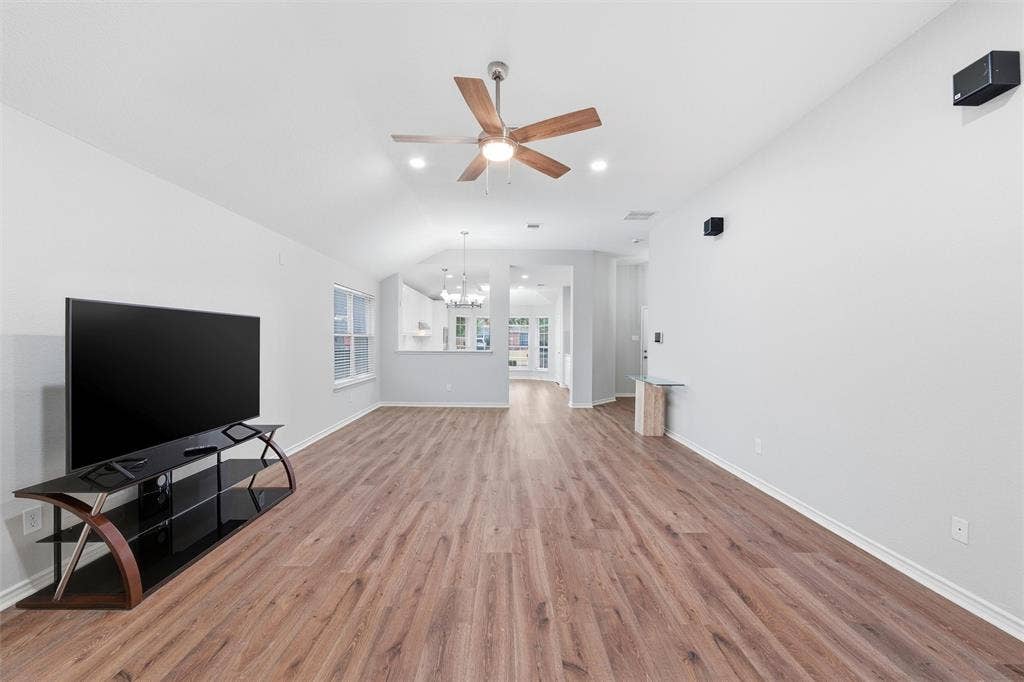Open layout designed for everyday living and entertaining, with sightlines extending from the living room into the dining area and updated kitchen.