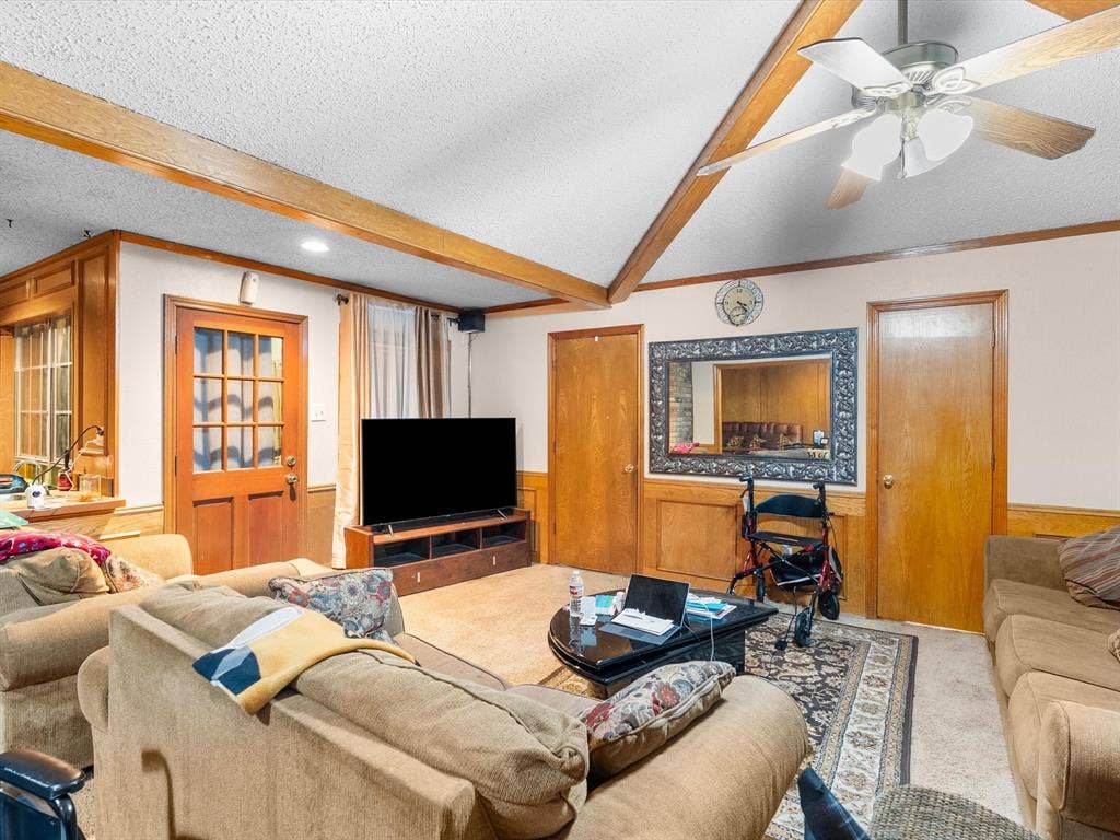 5818 Winding Woods Trail, Dallas, TX 75227 Wood-paneled walls and ceiling beams