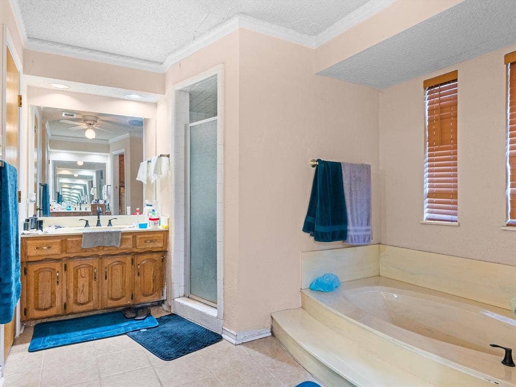 5818 Winding Woods Trail, Dallas, TX 75227 Dual vanity with wood cabinetry, large mirror, and tiled flooring