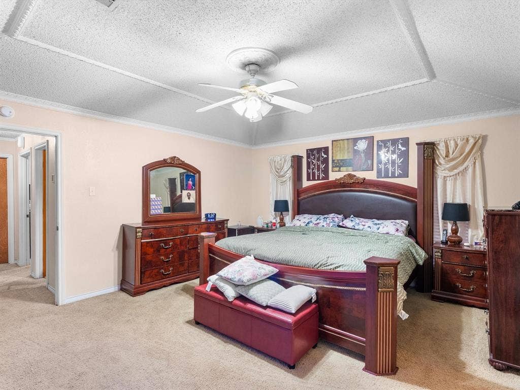 5818 Winding Woods Trail, Dallas, TX 75227 Recessed ceiling detail with an overhead fan, crown molding, and neutral wall tones