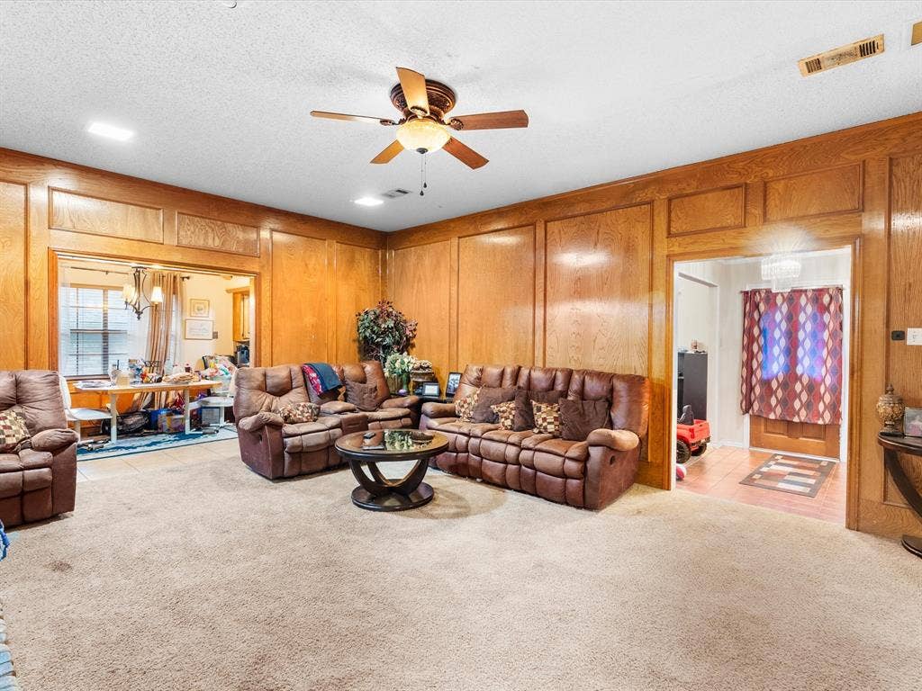 5818 Winding Woods Trail, Dallas, TX 75227 Wood-paneled walls with decorative trim, recessed lighting, and a ceiling fan