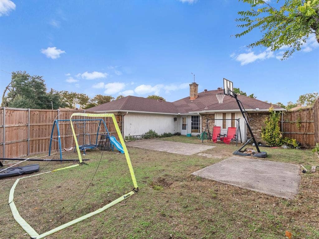 5818 Winding Woods Trail, Dallas, TX 75227 Fenced backyard with concrete patio areas