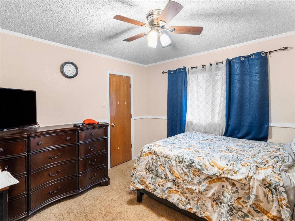 5818 Winding Woods Trail, Dallas, TX 75227 Ceiling fan with light fixture, textured ceiling, light-toned walls