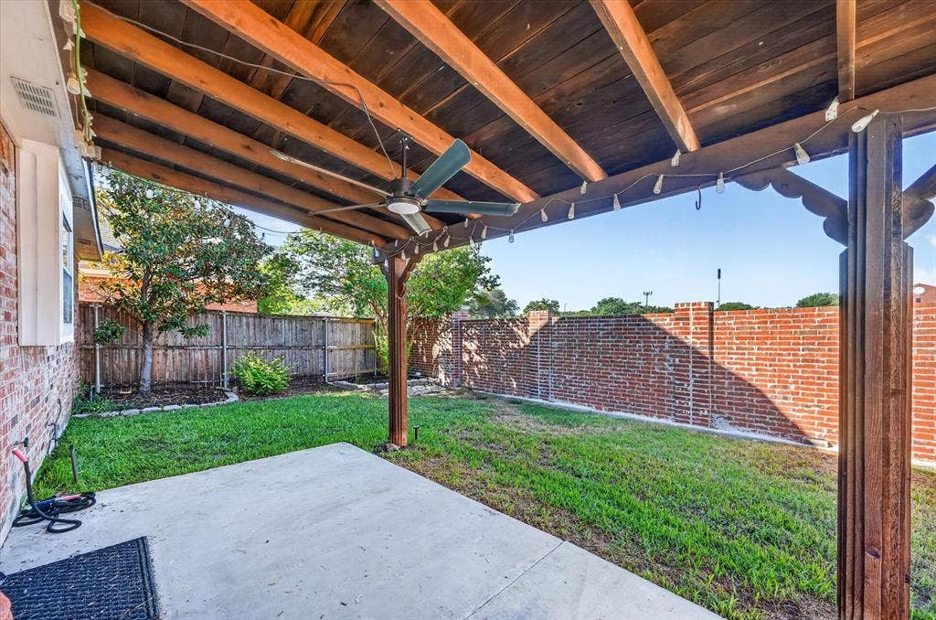 1825 Bachman Court, Plano, TX 75075 Covered patio featuring a wood ceiling, ceiling fan, and concrete flooring