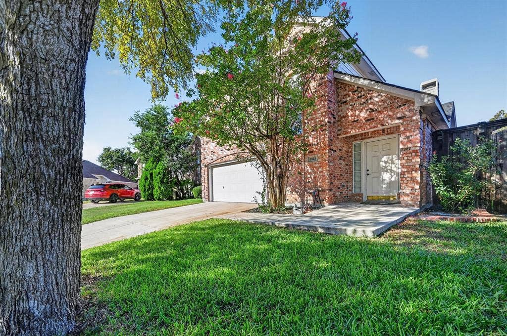 1825 Bachman Court, Plano, TX 75075 Red brick exterior with white trim