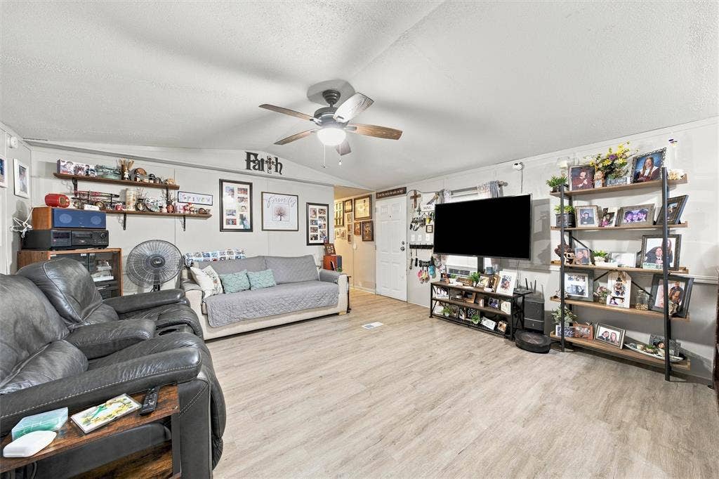 365 Beaver Lane, Waco, TX 76705 Wood-finish flooring throughout, ceiling fan with light fixture, and white painted walls
