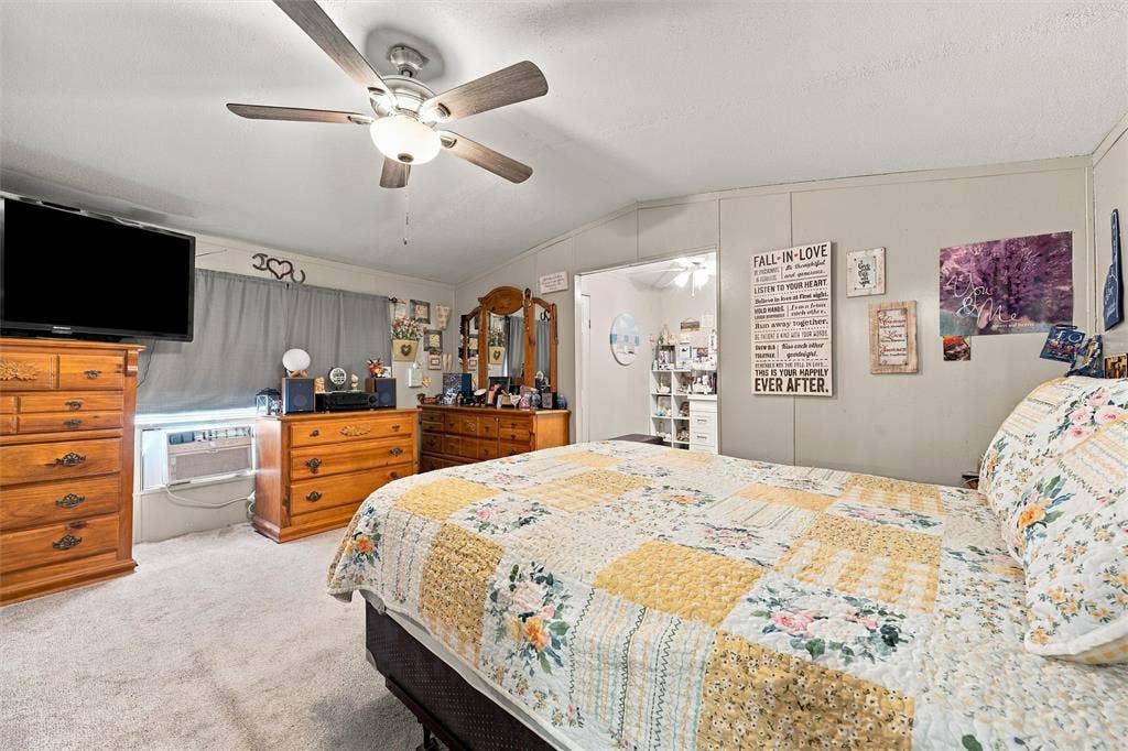 365 Beaver Lane, Waco, TX 76705 Ceiling fan with integrated lighting, carpeted flooring, and paneled walls