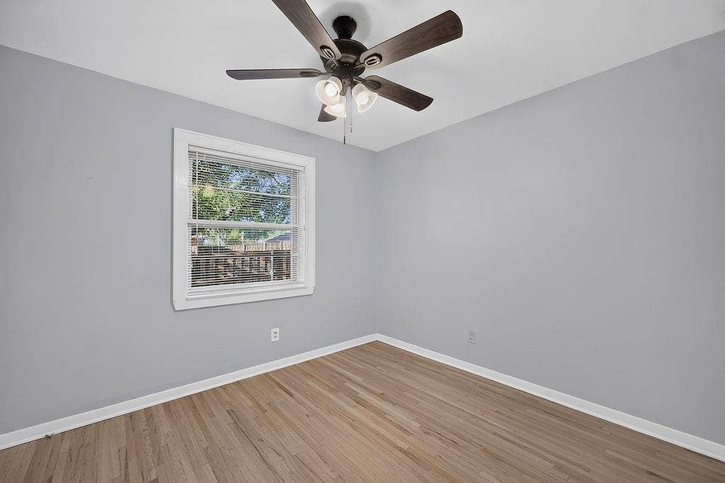 9112 Clearwater Drive, Dallas, TX 75243 Hardwood flooring, painted walls, ceiling fan with integrated lighting, and window with blinds