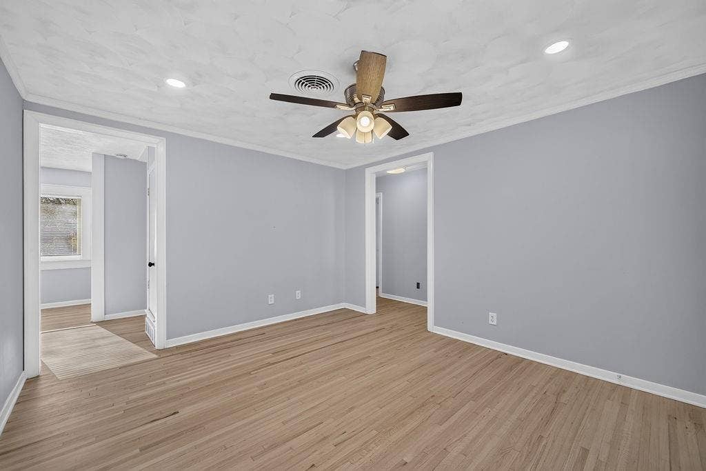 9112 Clearwater Drive, Dallas, TX 75243 Wood-finish flooring, recessed lighting, and a ceiling fan with integrated lighting