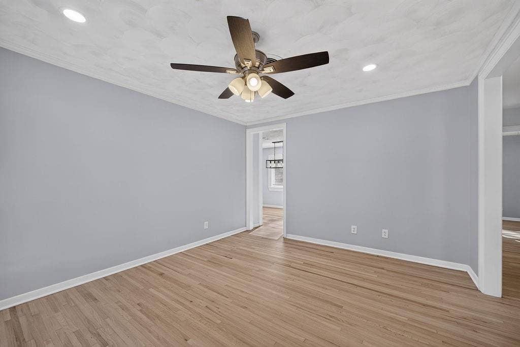 9112 Clearwater Drive, Dallas, TX 75243 Hardwood flooring, recessed lighting, and a ceiling fan with integrated light fixture
