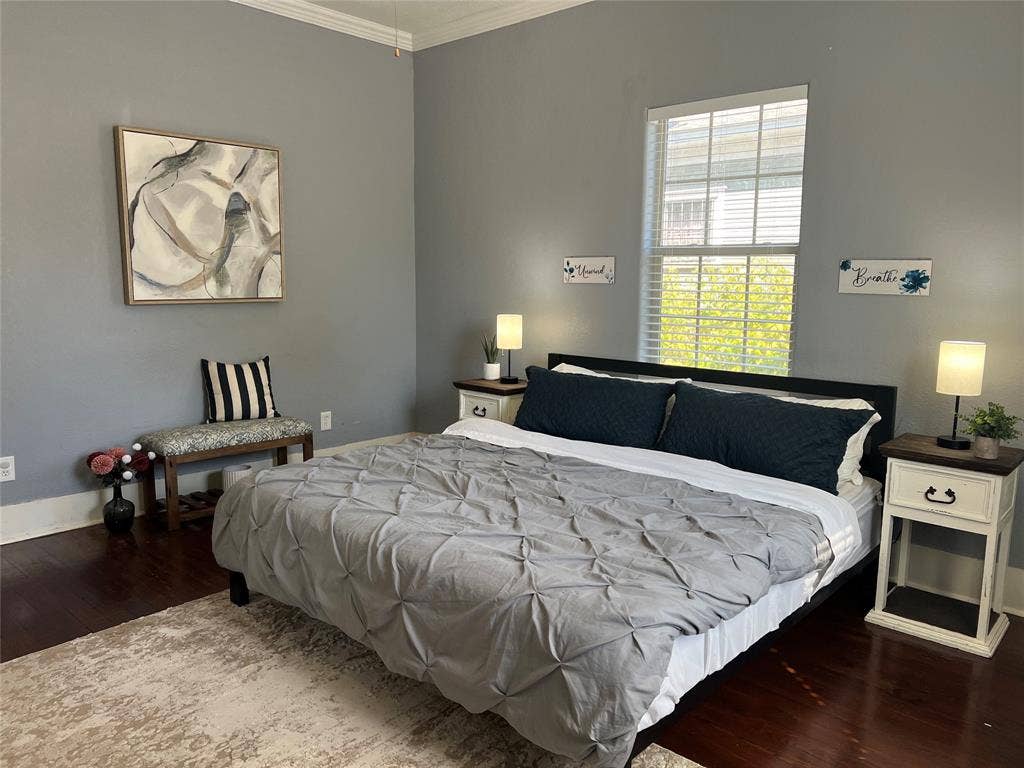 3227 Avenue I, Fort Worth, TX 76105 Hardwood-finish flooring, crown molding, and tall windows