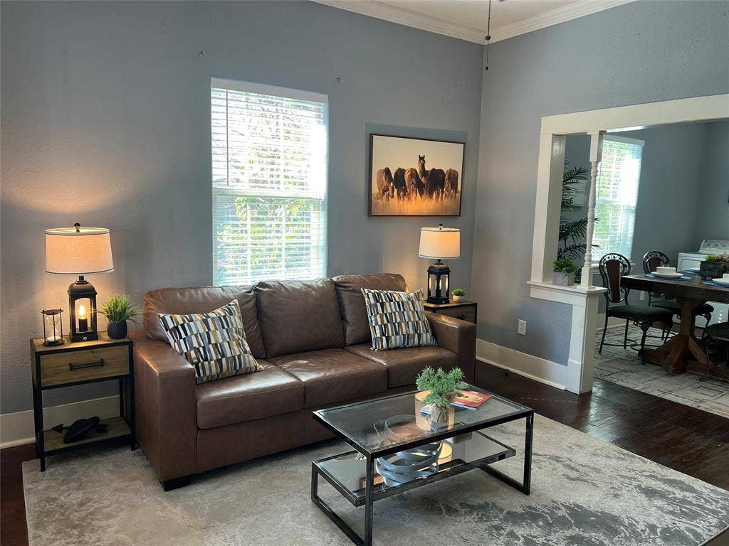 3227 Avenue I, Fort Worth, TX 76105 High ceilings with crown molding, wood-finish flooring, and a wide cased opening