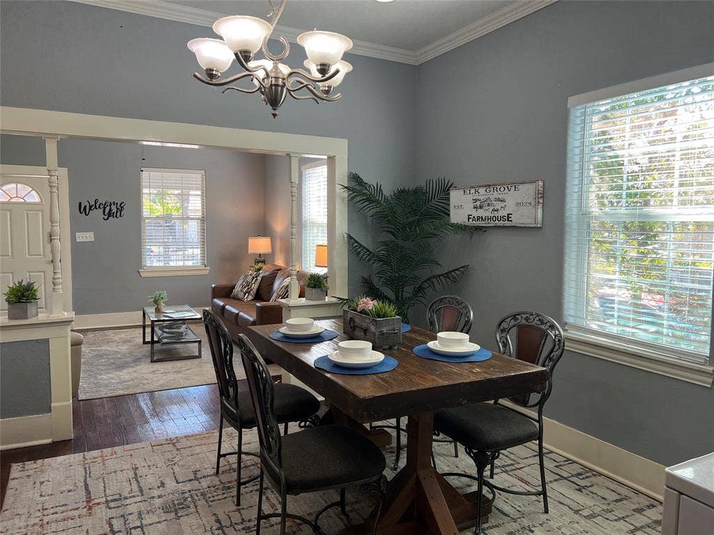 3227 Avenue I, Fort Worth, TX 76105 Crown molding, recessed lighting, and a chandelier illuminate the dining area