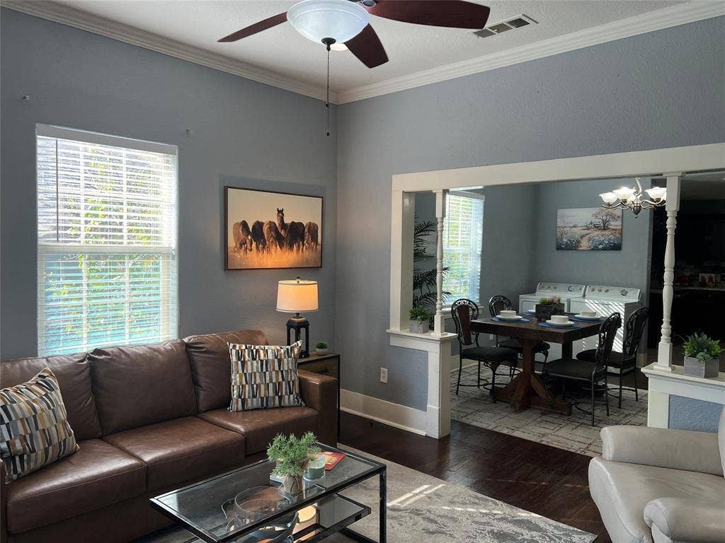3227 Avenue I, Fort Worth, TX 76105 Crown molding details, high ceilings, wood-finish flooring, and a ceiling fan with integrated lighting