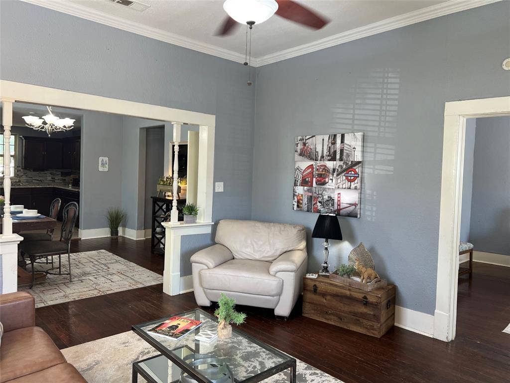 3227 Avenue I, Fort Worth, TX 76105 Wood-finish flooring throughout, ceiling fan, crown molding, and wide trim work