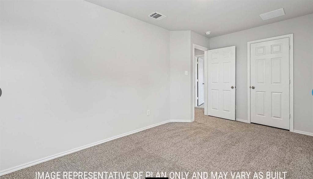 10408 Altair Drive, Waco, TX 76708 Neutral wall paint, carpeted flooring, and white interior doors