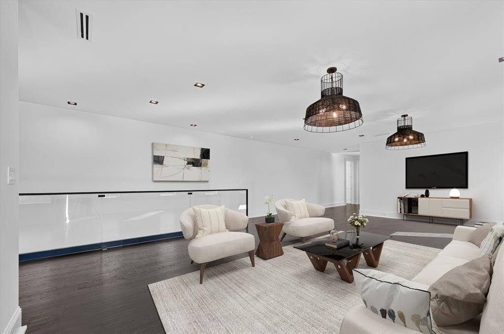 6404 Lakehurst Avenue, Dallas, TX 75230 Dark wood-finish flooring, recessed ceiling lighting, and two wire-frame pendant lights